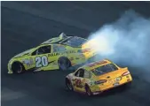  ?? TODD WARSHAW,
GETTY IMAGES ?? Matt Kenseth spins as Joey Logano races by en route to a victory Sunday at Kansas Speedway. Kenseth was angry after the race, blaming Logano.