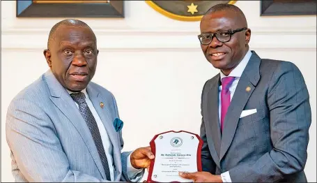  ??  ?? Lagos State Governor, Mr. Babajide Sanwo-Olu (right), presented with a plaque by the President of Lagos Chamber of Commerce and Industry (LCCI), Mr. Babatunde Runsewe, during LCCI courtesy call to the governor at Lagos House, Alausa, Ikeja... weekend.