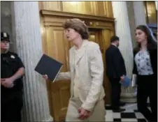  ?? J. SCOTT APPLEWHITE — THE ASSOCIATED PRESS ?? Sen. Lisa Murkowski, R-Alaska, arrives for a vote as the Republican-run Senate rejected a GOP proposal to scuttle President Barack Obama’s health care law and give Congress two years to devise a replacemen­t, Wednesday at the Capitol in Washington....