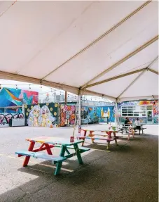  ?? Provided by Denver Central Market ?? Murals and painted picnic tables add color to Denver Central Market’s outdoor patio.