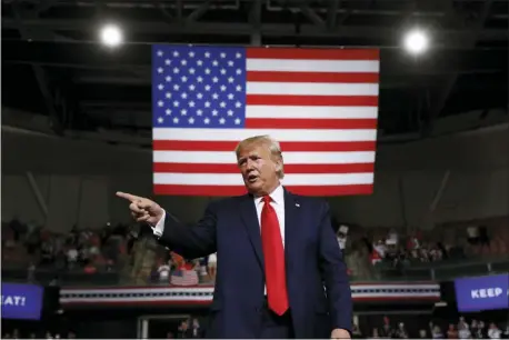  ?? PATRICK SEMANSKY — THE ASSOCIATED PRESS FILE ?? In this file photo, President Donald Trump reacts at the end of his speech at a campaign rally in Manchester, N.H.