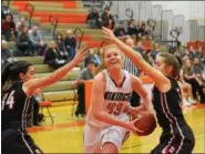  ?? THOMAS NASH - DIGITAL FIRST MEDIA ?? Perkiomen Valley’s Megan Jonassen (43) drives to the basket between a pair of Boyertown defenders during Tuesday night’s game.