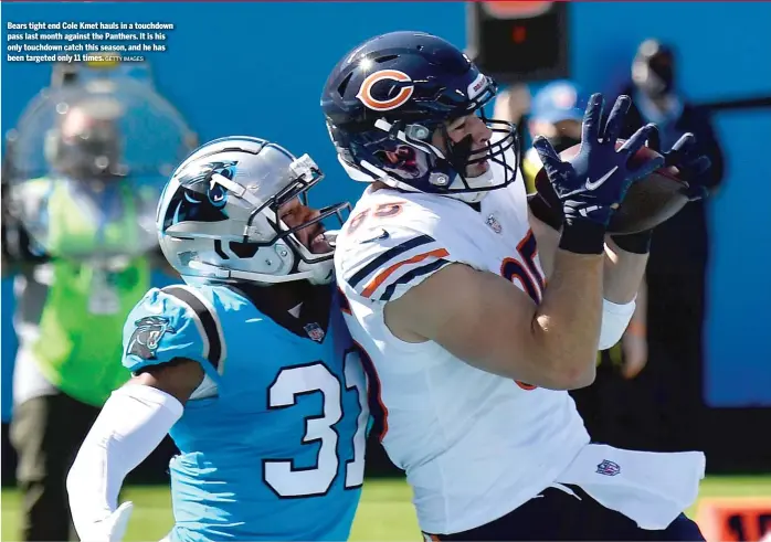  ?? GETTY IMAGES ?? Bears tight end Cole Kmet hauls in a touchdown pass last month against the Panthers. It is his only touchdown catch this season, and he has been targeted only 11 times.