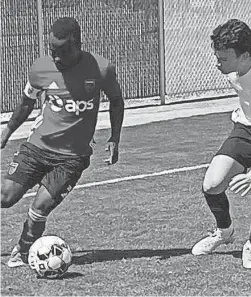  ?? EDWIN PEREZ/THE REPUBLIC ?? Solomon Asante, left, of Phoenix Rising FC maneuvers around a Union Omaha defender during a preseason match in March at the Rising's new Wild Horse Pass facility.