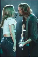  ?? Associated Press photo ?? This image released by Warner Bros. Pictures shows Lady Gaga, left, and Bradley Cooper in a scene from “A Star is Born.”