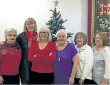 ?? SPECIAL TO THE EXAMINER ?? These Christmas elves helped bring a Christmas tea to the Lakehurst Hall. Sandwiches of all varieties with sweet squares and bars, tea and coffee brought the Christmas spirit alive to those attending.