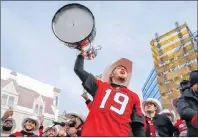  ?? CP PHOTO ?? Calgary Stampeders quarterbac­k Bo Levi Mitchell, celebrates winning the Grey Cup at a ceremony in Calgary on Tuesday.