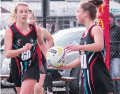  ??  ?? Bringing the ball out of defence are Warragul’s Christie Hillberg (left) and Alexandra Cole during an 11-goal A grade win.