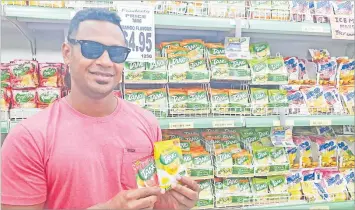  ?? Picture: SUPPLIED ?? Sukulu Cama from Robertson Rd with Tang at Food City Supermarke­t, Suva.