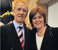  ??  ?? ‘NATIONAL TREASURE’ Johnny with Nicola Sturgeon