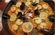  ?? SHIVANA MAHARAJ FOR THE TORONTO STAR ?? The signature paella del mar (seafood paella) at Aventura. The restaurant boasts a Spanish menu that extends to its wine and cocktail lists.