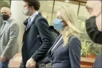  ?? MIKE LIEDTKE - THE ASSOCIATED PRESS ?? In this image take from video, Elizabeth Holmes leaves the United States Federal Courthouse, Friday, in San Jose, Calif. The fallen Silicon Valley star, accused of bamboozlin­g investors and patients into believing that her startup Theranos had developed a blood-testing device that would reshape health care, took the witness stand Friday in her trial for criminal fraud.