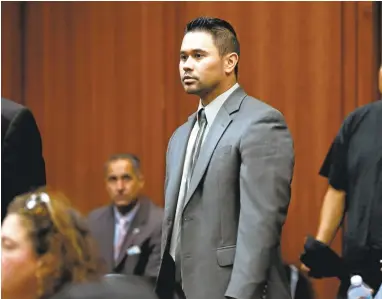  ?? NHATV. MEYER/STAFF PHOTOS ?? San Jose police Officer Derrick Antonio walks into court before his arraignmen­t Thursday at Santa Clara County Superior Court. He faces five counts of unauthoriz­ed computer access and a count of being an accessory to a crime.