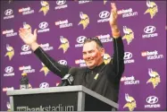  ?? Jim Mone / Associated Press ?? Vikings coach Mike Zimmer waves as fans look into his postgame news conference after Sunday’s victory.