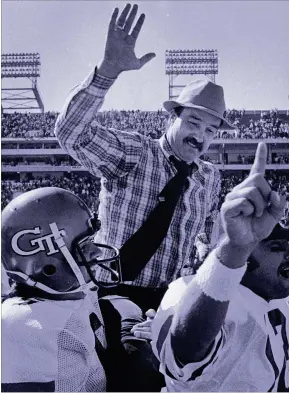  ?? AJC FILE ?? Georgia Tech coach Pepper Rodgers is carried off the field by his players after a big win in 1978. In six years coaching at Tech, running the wishbone offense, he recorded four winning seasons.