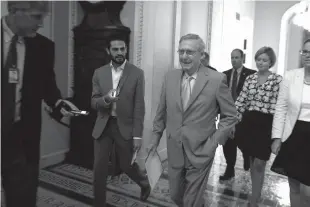  ?? Associated Press ?? Senate Majority Leader Mitch McConnell, R-Ky., walks to the Senate Chamber on Sunday to begin a special session to extend surveillan­ce programs, in Washington.