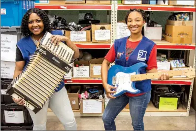  ?? (Arkansas Democrat-Gazette/Cary Jenkins) ?? Goodwill Industries of Arkansas never knows what items are going to be donated. As “listers,” it is the job of Courtney Piggee and Maliyah Reynolds to determine what the items are worth.