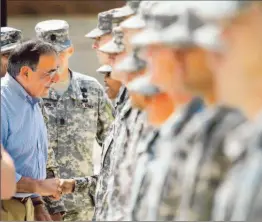 ?? Mike Haskey Columbus, Ga., Ledger-enquirer ?? DEFENSE SECRETARY Leon E. Panetta meets soldiers at Ft. Benning, Ga., after a speech in which he urged them to maintain strict standards of conduct.