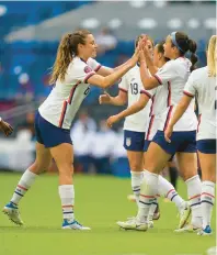  ?? FERNANDO LLANO/AP ?? The United States’ Sophia Smith, second from right, is congratula­ted by a teammate after scoring her team’s second goal against Jamaica on Thursday night.