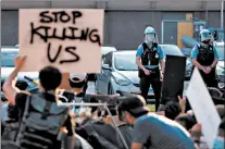  ?? TERRENCE ANTONIO JAMES/CHICAGO TRIBUNE ?? Thousands of people protest against Chicago Police in public schools and against acts of violence by police on June 4 in Chicago.