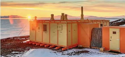  ??  ?? The sun rises on the Trans-Antarctic expedition hut at Scott Base, Antarctica.