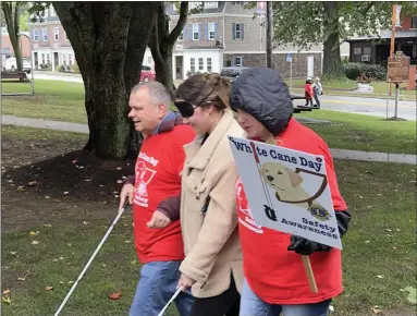  ?? MARAH MORRISON — THE NEWS-HERALD ?? Alongside the blind and visually impaired, people were put to the test in Willoughby over the weekend in light of National White Cane Safety Day.