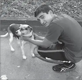  ?? [THE UNDERINER FAMILY] ?? Tarak Underiner with his dog, Ace, while he was moving into a campus apartment.