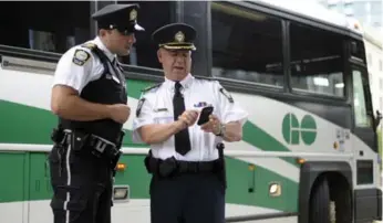  ?? AARON HARRIS/TORONTO STAR FILE PHOTO ?? GO Transit safety officers have been told not to wear their uniforms to this year’s Pride parade because they might be mistaken for police officers, who have been barred from marching in the parade in uniform.