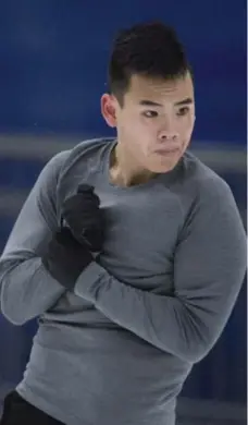  ?? JONATHAN HAYWARD/THE CANADIAN PRESS ?? Nam Nguyen, who burst onto the skating scene at age 12, is working quads back into his routine at 19 — and almost 6 feet tall.