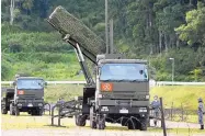  ?? RYOSUKE OZAWA/KYODO NEWS ?? A PAC-3 intercepto­r is deployed in the compound of a garrison of the Japan Ground Self-Defense Force in Konan, Kochi prefecture, Japan, Saturday.