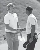  ?? DARREN CARROLL/GETTY IMAGES ?? Brandt Snedeker shakes hands after defeating Tiger Woods 2 and 1 Thursday.