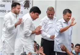  ?? — PTI ?? RJD leader Tejashwi Prasad Yadav, AAP leaders Sanjay Singh and Somnath Bharti with Delhi chief minister Arvind Kejriwal in New Delhi on Saturday during a protest over the issue of alleged sexual abuse at a government- funded shelter home in Bihar’s Muzaffarpu­r district.