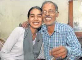  ?? PARDEEP PANDIT/HT ?? Jalandhar’s Jyoti Mahey, who topped the district with 97.23% marks, with her father.
