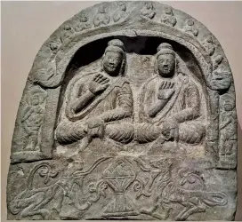  ??  ?? A sculpture featuring two Buddhas is on display. Evidence show that myriads of Buddha sculptures and figurines were found along the Silk Road, representi­ng a major link in cultural exchanges along the route.