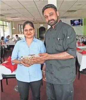  ?? MICHAEL SEARS, MILWAUKEE JOURNAL SENTINEL ?? Paramjit Kaur (left) bought Royal India last year. Her brother, Jaswinder Singh, is the chef.