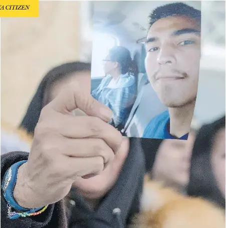  ?? LIAM RICHARDS/THE CANADIAN PRESS ?? Debbie Baptiste, the mother of Colten Boushie, holds up a picture of her son as she leaves the Court of Queen’s Bench during a lunch recess on Monday, the fifth day of the trial of Gerald Stanley, the farmer accused of killing the 22-year-old...