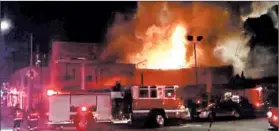  ?? @OAKLANDFIR­ELIVE ?? A still from a video shows the warehouse fire early Saturday in Oakland, Calif. Nine bodies were recovered, officials say.