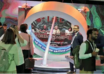  ?? — AFP photo ?? People tour the India pavillon at the Sharm el-Sheikh Internatio­nal Convention Centre, in Egypt’s Red Sea resort city of the same name, during the COP27 climate conference.