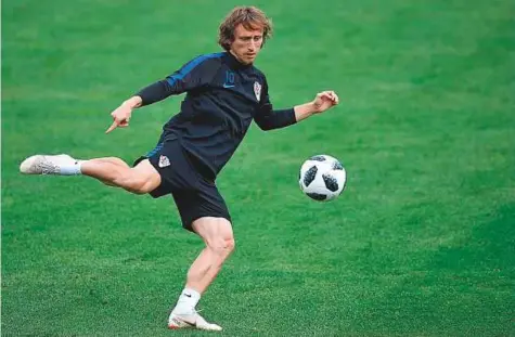  ?? AFP ?? Croatia’s midfielder Luka Modric takes part in a training session at the Roschino Arena, outside Saint Petersburg on Friday. Croatia take on Denmark in the Round of 16 today.