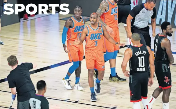  ?? [AP PHOTO/ASHLEY LANDIS] ?? Chris Paul (3) looks to referee James Capers (19) during the first half of Oklahoma City's 114-80 loss to Houston in Game 5 Saturday in Lake Buena Vista, Fla.