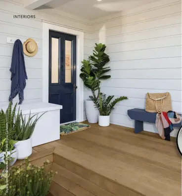  ??  ?? LEFT / A classic beachy Cape Cod look is achieved for the entrancewa­y of this home. Weatherboa­rds Resene Half Periglacia­l Blue, Benchseat Resene Coast, Storage Box Resene Poured Milk, Pots Resene Slipstream and Resene Grey Seal.