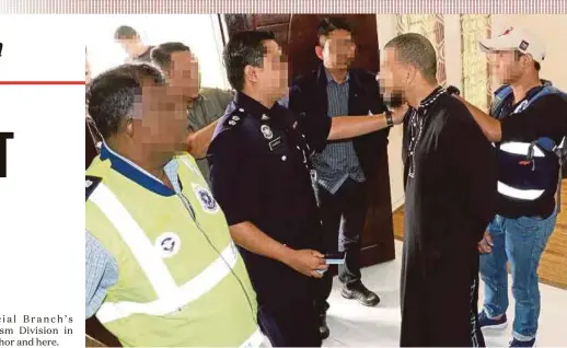  ?? PIC COURTESY OF THE POLICE ?? One of the terrorist suspects being questioned after his arrest in Kuala Lumpur recently.