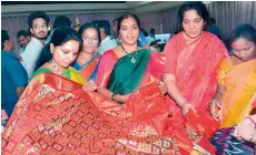  ?? — DC ?? MP K. Kavitha and other legislator­s select sarees at the retail outlet set up by the TS Handloom Cooperativ­e Society in Assembly premises on Friday.