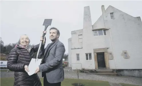  ??  ?? 0 Ruth Currie, granddaugh­ter of original owner Walter Blackie, joined architect Andy Groarke to break ground for the chainmail ‘box’