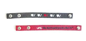  ??  ?? Roots has teamed up with the Heart and Stroke Foundation of Canada with such limited-edition items as these leather bracelets, which sell for $10. A tuque goes for $26.
