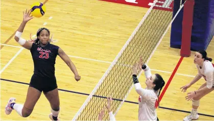  ?? JASON MALLOY ?? Acadia Axewomen middle blocker Wesley-Ann Bailey, left, prepares to smash the ball during Atlantic University Sport volleyball action against the Memorial Sea-Hawks Jan. 28 in Wolfville. Acadia won the match 3-0 (25-18, 25-11, 25-20). Sydney Zakutney had seven kills, three aces and eight digs while Eve Collombin had six kills, three blocks and an ace. The Axewomen completed the weekend sweep by winning 3-0 (25-17, 25-12, 25-12) on Jan. 29. Taylor Witty had five kills while Charlotte Dean had four aces and Rebecca Dorsey 13 digs. Acadia improved to 11-3 while Memorial fell to 0-13. Acadia also defeated Moncton 3-1 (25-20, 25-22, 20-25, 26-24) on Jan. 25.