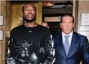  ?? New York Daily News Archive via Getty Images ?? Rapper Meek Mill, left, and his defense lawyer Joe Tacopina leave Manhattan Criminal Court after Mill was released in 2017. Mill had been arrested for allegedly popping wheelies on a dirt bike.