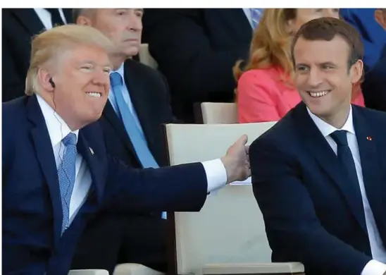  ?? FOTO: MICHEL EULER, AP/NTB SCANPIX ?? Både Trump og Macron skapte jordskjelv i det etablerte politiske landskapet med sine valgseire, men politisk sett er de uenige om det meste.