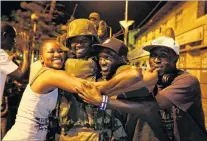  ?? PHOTO: REUTERS ?? Reason to cheer . . . People celebrate the arrival of the regional Ecowas force in Gambia on Sunday night.
