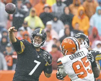  ?? Peter Diana/Post-Gazette ?? Ben Roethlisbe­rger was pressured repeatedly by defensive end Myles Garrett in Week 1 in Cleveland. An improving Steelers line will try to slow Garrett on Sunday.